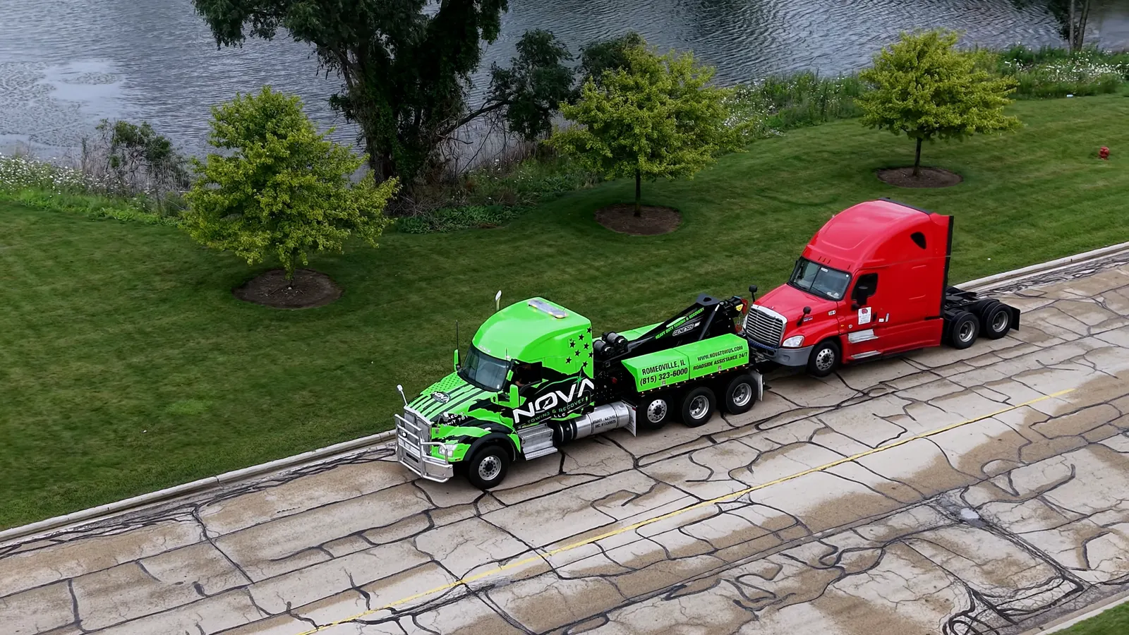 Aerial view of a NOVA heavy-duty wrecker towing a semi truck